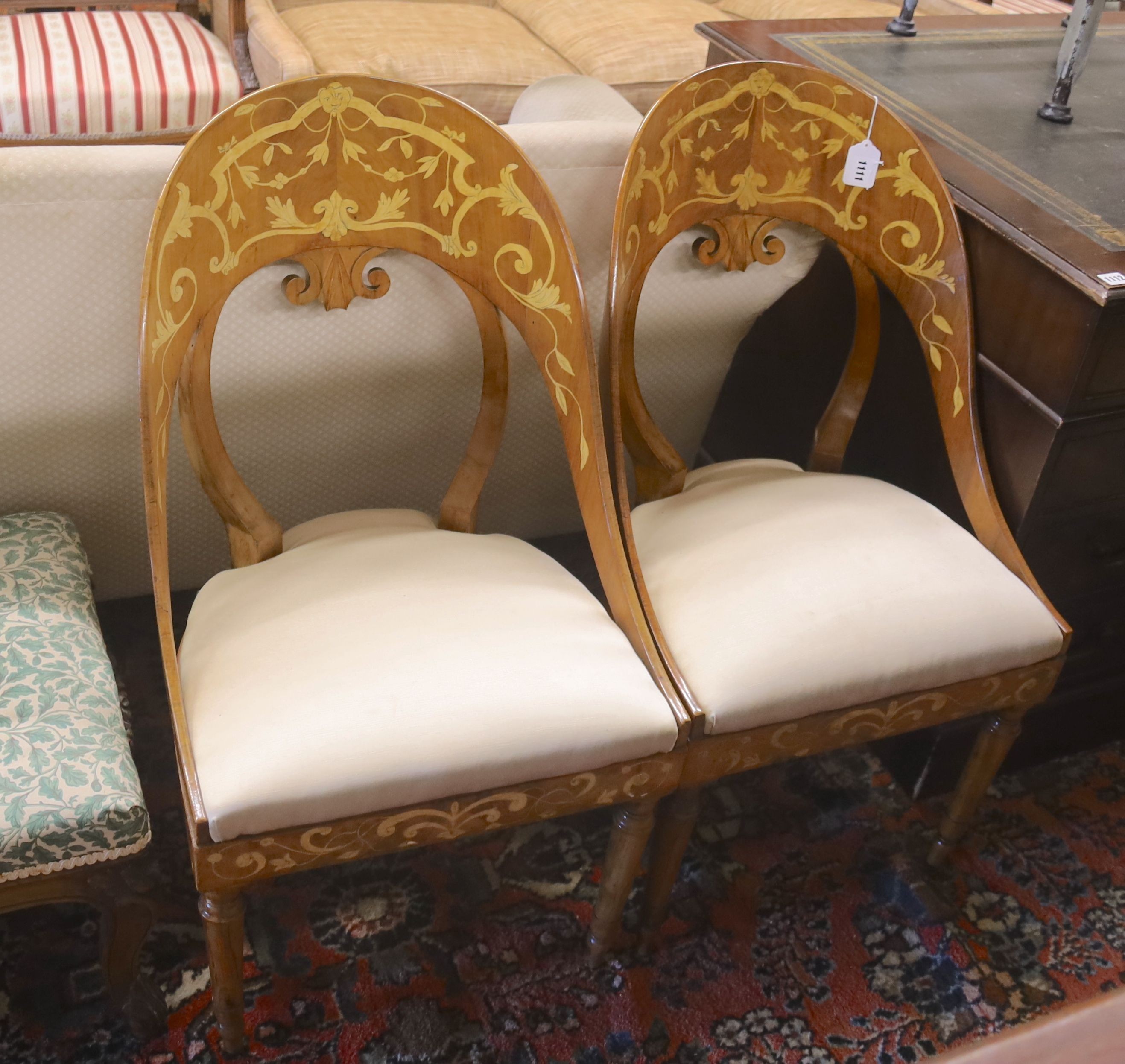 A pair of Italian walnut marquetry inlaid chairs, width 48cm, depth 40cm, height 90cm
